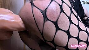 Shemale stuffs huge dildo deep in narrow ass cage play