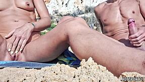 Hot athletic couple flashes mutual masturbation handjob on public beach