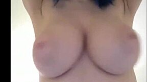 Blue-haired teen with huge breasts chats casually