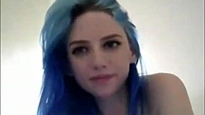 Blue-haired teen with huge breasts chats casually