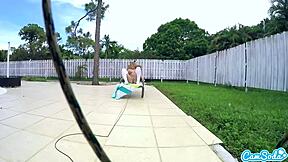 Teen lesbians engage in playful tug-of-war with a drone outdoors.