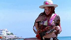 pretty redhead emy russo strips on beach