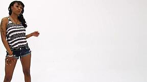 A pretty ebony teen model with small natural tits poses for photos