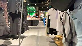 The girl completes the purchase in the locker room