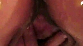 hot brunette rides dildo in oily bathtub