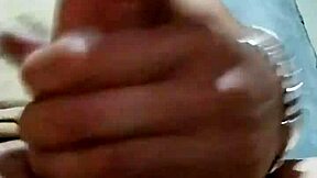 I'm masturbating in the bathroom at my job, feeling horny and reaching orgasm with my cock