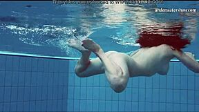 Hot teen swims underwater and strips