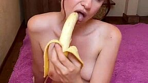 Watch this hot brunette suck on a banana