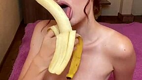 Watch this hot brunette suck on a banana