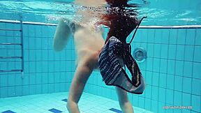 Redheaded Katrin Rips Clothes Off Underwater in Intense Tease