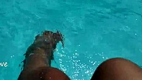 Young Amateur Plays with Feet in Pool