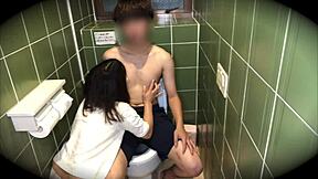 Amateur Asian couple's wild toilet encounter with big tits and blowjob