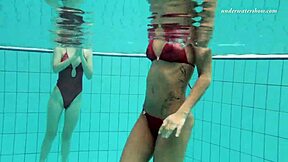 Enjoying steamy lesbian sex underwater, teenage couple