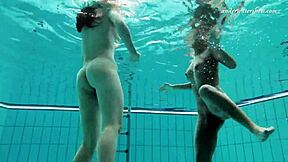 Enjoying steamy lesbian sex underwater, teenage couple