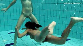 Enjoying steamy lesbian sex underwater, teenage couple