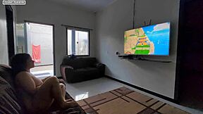 teen sits on lap playing game, feels huge cock