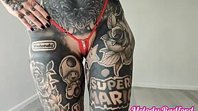 Melody Radford tries on sheer micro bikinis in a steamy photoshoot session.