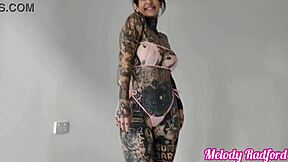 Melody Radford tries on sheer micro bikinis in a steamy photoshoot session.