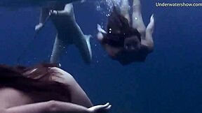 Girls Swimming Underwater on Tenerife Beach