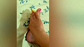 young babe stroking her sexy feet with pink pedicure?