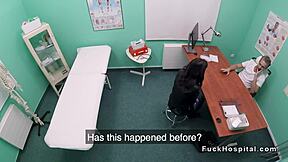 Doctor interacts with petite patient in a fake hospital environment