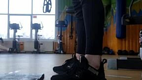 In the gym, a young british female shakes her ass seductively