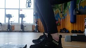 In the gym, a young british female shakes her ass seductively