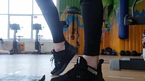 In the gym, a young british female shakes her ass seductively