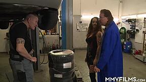 Tattooed babe rides monster cocks in garage threesome