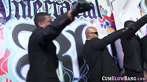 Slender young cute babe gets a sloppy blowjob and a big sloppy jerk off from big black cocks