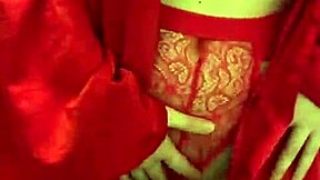 brunette in red lingerie plays with her big tits