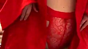 brunette in red lingerie plays with her big tits