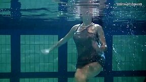 i watch katya okuneva bouncing her titss in a dress at the pool partyy