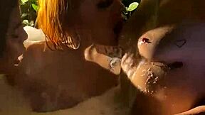 Three lesbians kiss in jacuzzi, she whispers.