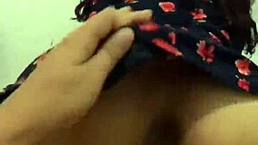 The neighbor was wearing a beautiful floral dress for the massage