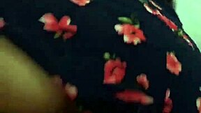 The neighbor was wearing a beautiful floral dress for the massage