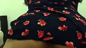 The neighbor was wearing a beautiful floral dress for the massage