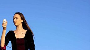 Watch her big tits bounce as she plays on the rock?