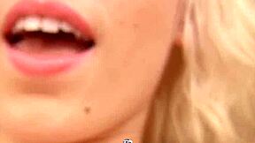 Pierced blonde masturbates with toy