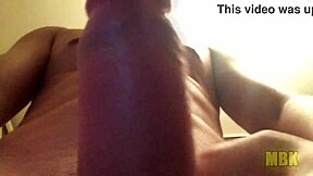 Alone at home, a young teen masturbates with big cock in hand