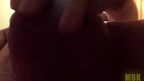 Alone at home, a young teen masturbates with big cock in hand