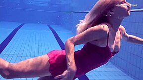 elena proklova looks so damn sexy alone by the pool in that tight dress. her tattoo just adds to the vibe.