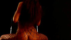 A classy Russian babe poses solo in fishnets and stockings