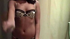 This video shows a sexy brunette teen stripping from lingerie to nude for a blowjob