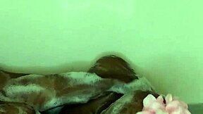 ebony wife enjoys fetish massage in bath with milf