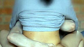 schoolgirl looks mischievously at her companion in the apartment