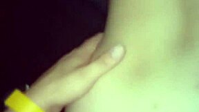 A young woman enjoys intimate moments in a private setting