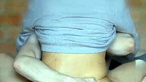 schoolgirl looks mischievously at her companion in the apartment