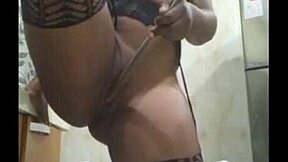 the attractive african girl shows off her beautiful body in stockings and pantyhose at home