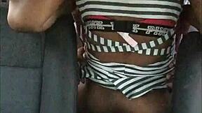 People engage in intense activity inside a car